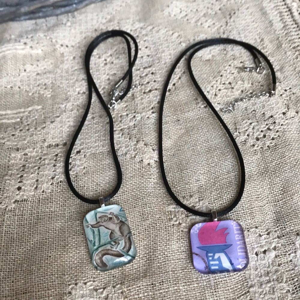 Postage stamp, handmade necklaces.